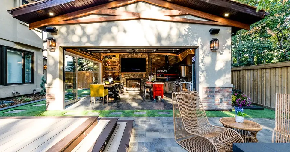 Luxurious outdoor living space with an open-concept kitchen, dining area, and patio seating.