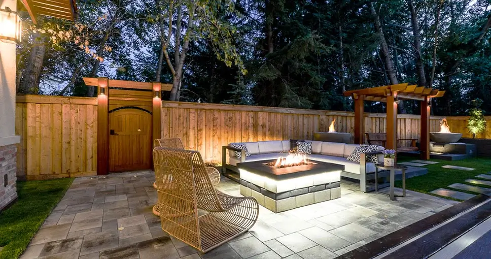 Cozy outdoor patio with a fire pit and seating.
