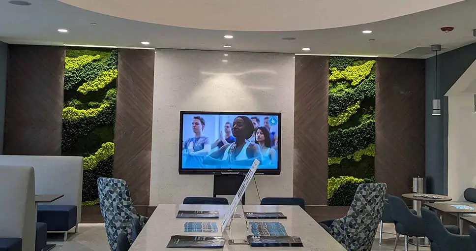 Modern interior with decorative green moss walls.
