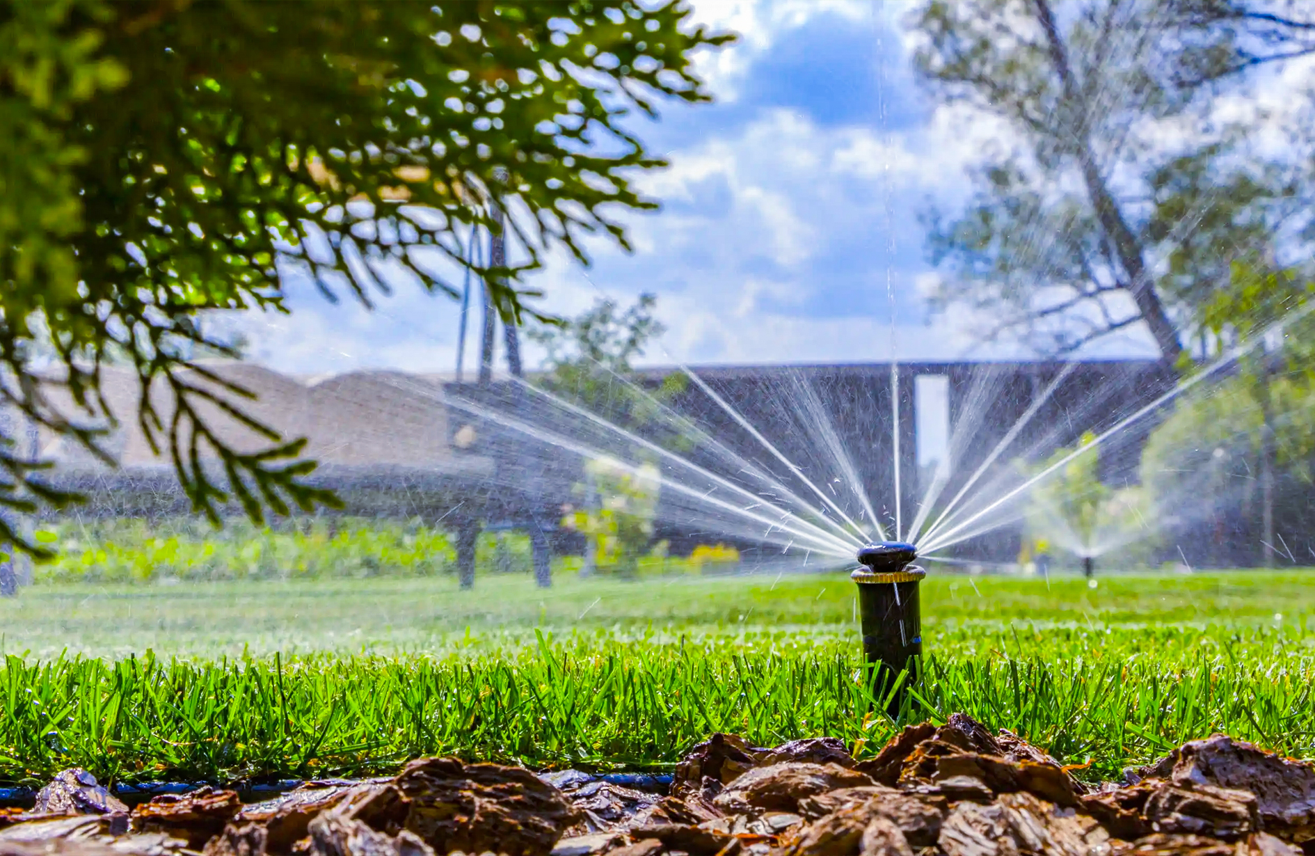 Irrigation systems in Edmonton used for residential lawn watering with sprinkler in action