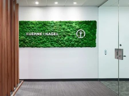 Kuehne+Nagel moss wall logo in an office.