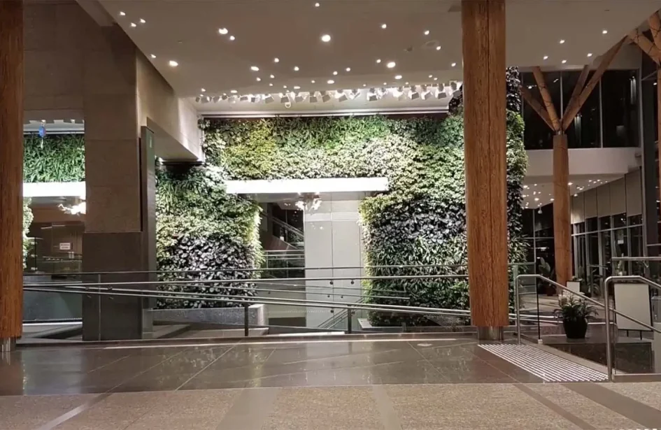 Large vertical living walls in a modern building lobby.