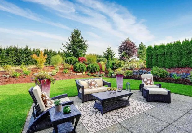 Beautiful backyard patio and garden designed by a top landscape design company Edmonton