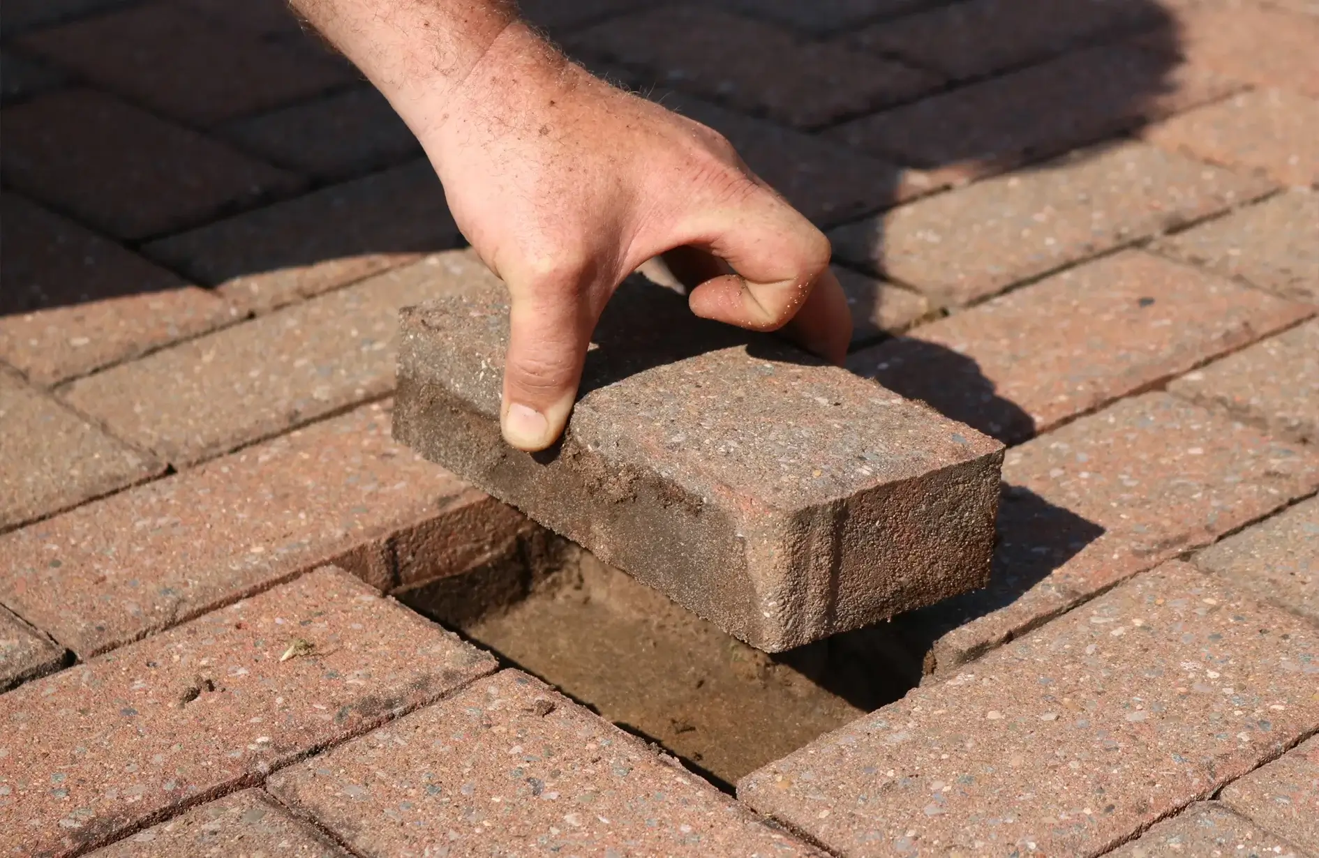 Driveway paving repair with interlocking pavers