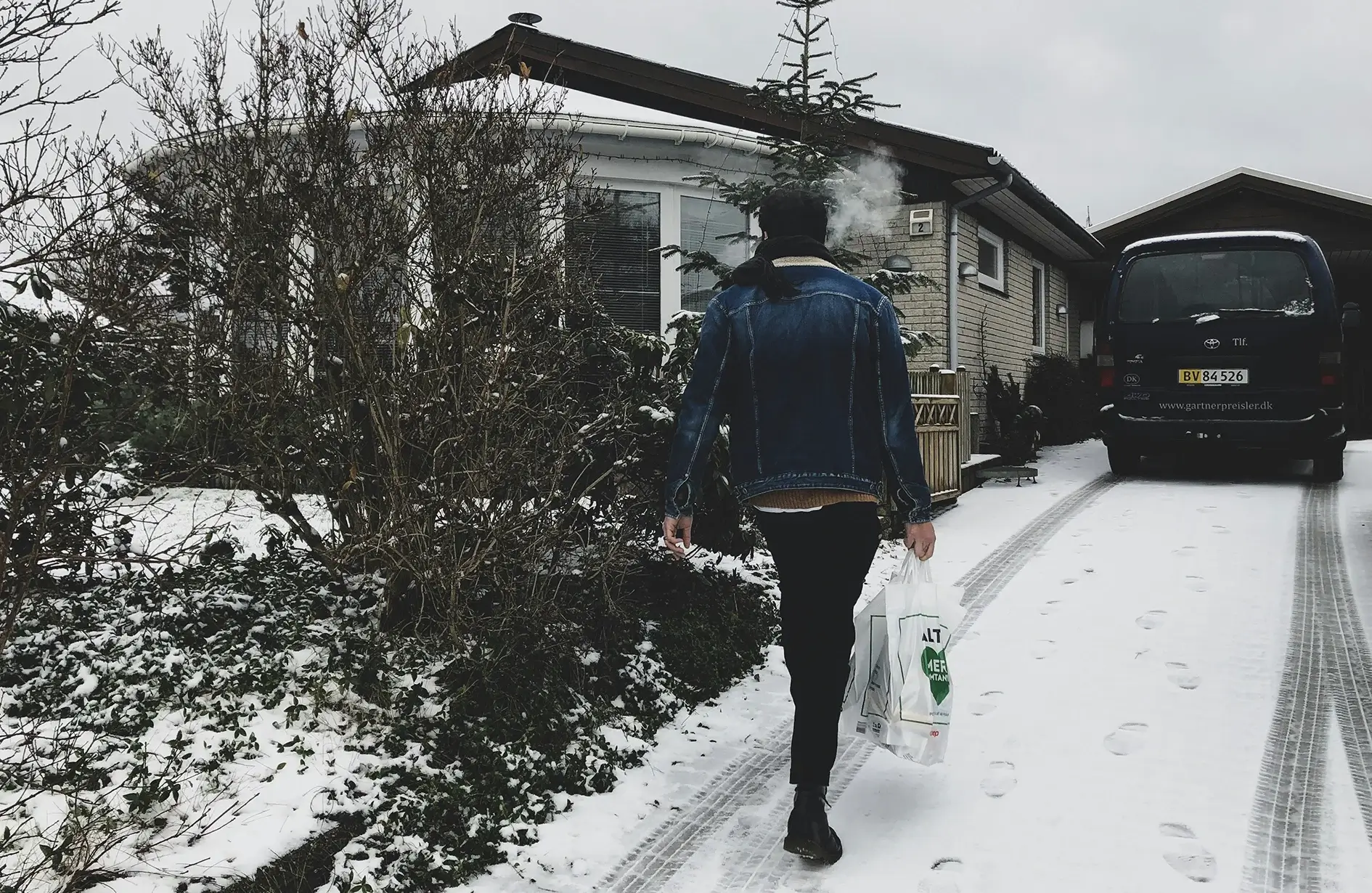 Person walking on snowy driveway