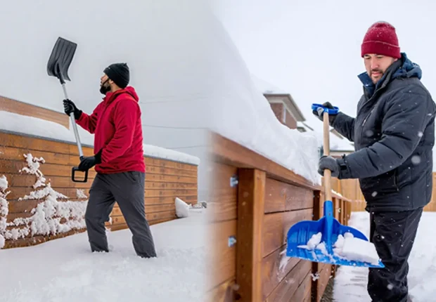 Edmonton landscapers clearing snow piles from pressure-treated wood retaining wall during winter frost protection maintenance.​